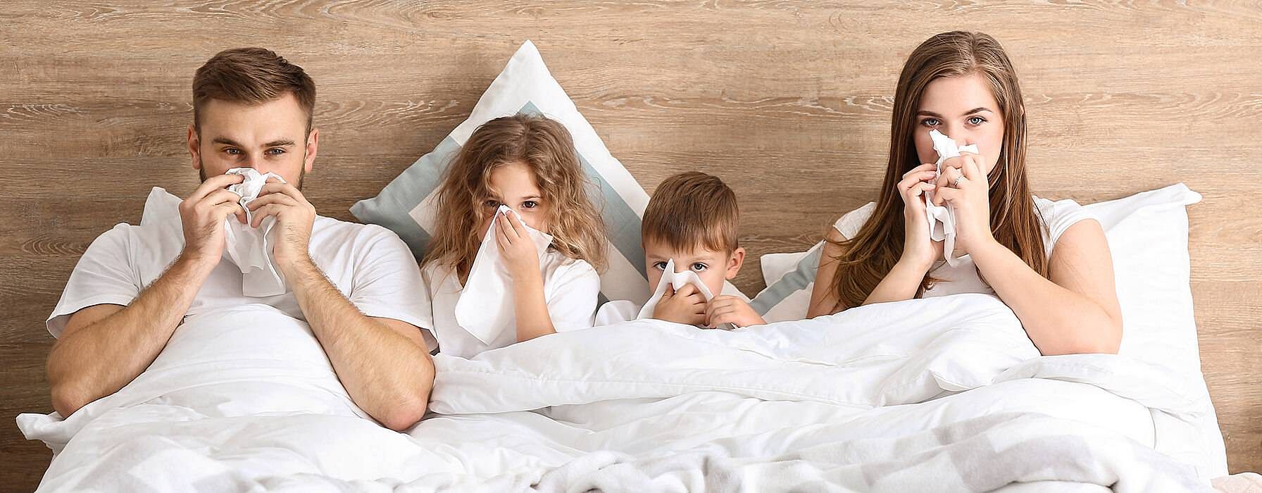 familie im bett