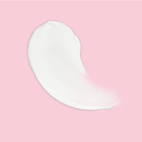 Weiße Creme auf rosa Hintergrund