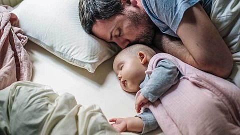 parents and baby are sleeping